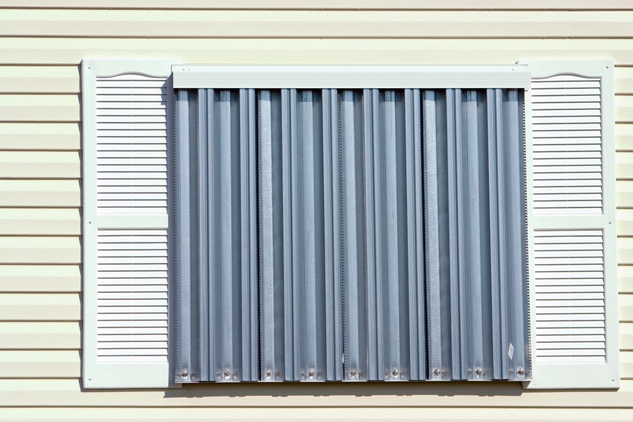 Storm panels protecting a home exterior